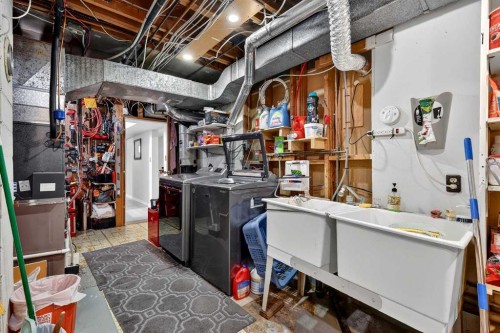 33 Warwick Drive Sw, Calgary, AB - Indoor Photo Showing Laundry Room
