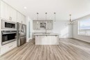 100 Corner Glen Manor Ne, Calgary, AB  - Indoor Photo Showing Kitchen With Stainless Steel Kitchen With Upgraded Kitchen 