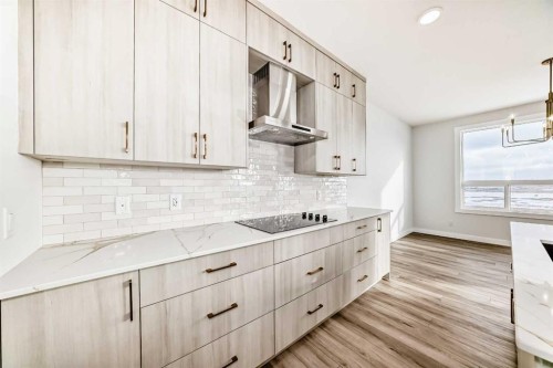 100 Corner Glen Manor Ne, Calgary, AB - Indoor Photo Showing Kitchen With Upgraded Kitchen