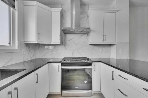 26 Amblehurst Path Nw, Calgary, AB - Indoor Photo Showing Kitchen With Upgraded Kitchen