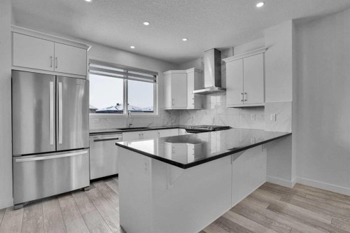 26 Amblehurst Path Nw, Calgary, AB - Indoor Photo Showing Kitchen With Upgraded Kitchen