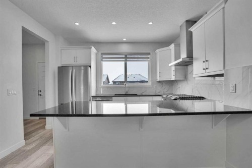 26 Amblehurst Path Nw, Calgary, AB - Indoor Photo Showing Kitchen With Upgraded Kitchen