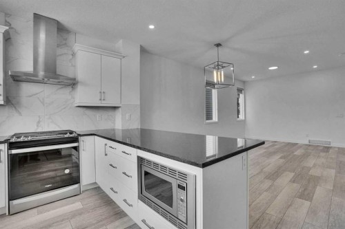 26 Amblehurst Path Nw, Calgary, AB - Indoor Photo Showing Kitchen With Upgraded Kitchen
