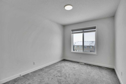 26 Amblehurst Path Nw, Calgary, AB - Indoor Photo Showing Other Room
