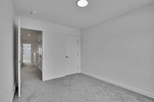 26 Amblehurst Path Nw, Calgary, AB - Indoor Photo Showing Other Room