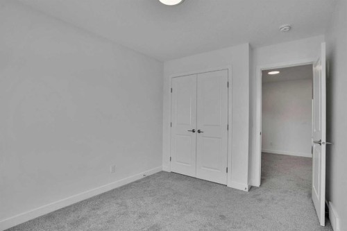 26 Amblehurst Path Nw, Calgary, AB - Indoor Photo Showing Other Room