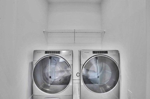 26 Amblehurst Path Nw, Calgary, AB - Indoor Photo Showing Laundry Room