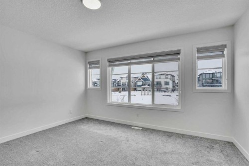 26 Amblehurst Path Nw, Calgary, AB - Indoor Photo Showing Other Room