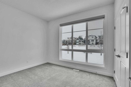 26 Amblehurst Path Nw, Calgary, AB - Indoor Photo Showing Other Room