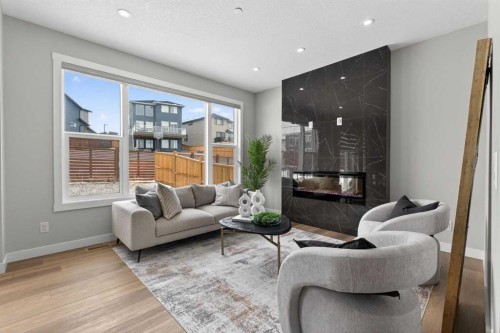 31 Herron Rise Ne, Calgary, AB - Indoor Photo Showing Living Room With Fireplace