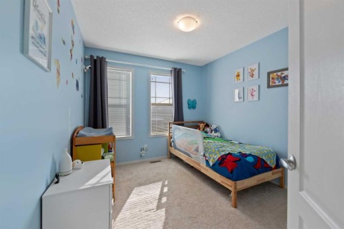 159 Evansborough Crescent Nw, Calgary, AB - Indoor Photo Showing Bedroom