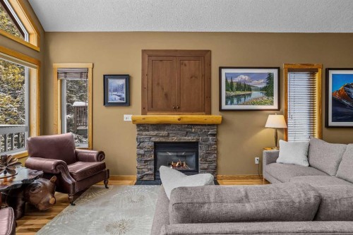 1112 Wilson Way, Canmore, AB - Indoor Photo Showing Living Room With Fireplace