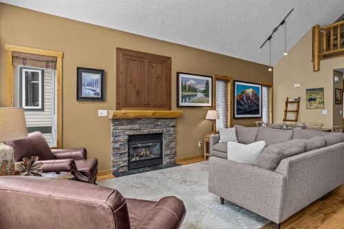 1112 Wilson Way, Canmore, AB - Indoor Photo Showing Living Room With Fireplace