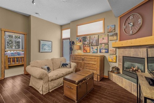 1112 Wilson Way, Canmore, AB - Indoor Photo Showing Living Room With Fireplace