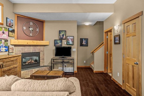 1112 Wilson Way, Canmore, AB - Indoor Photo Showing Living Room With Fireplace
