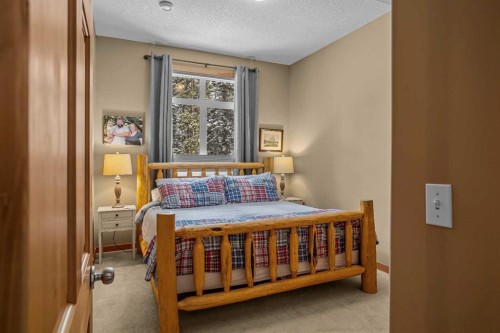 1112 Wilson Way, Canmore, AB - Indoor Photo Showing Bedroom
