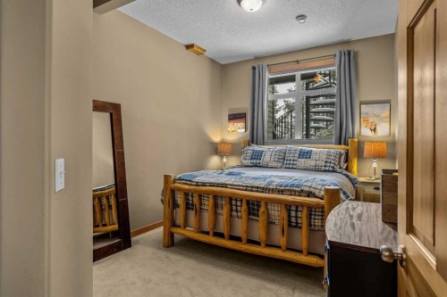 1112 Wilson Way, Canmore, AB - Indoor Photo Showing Bedroom
