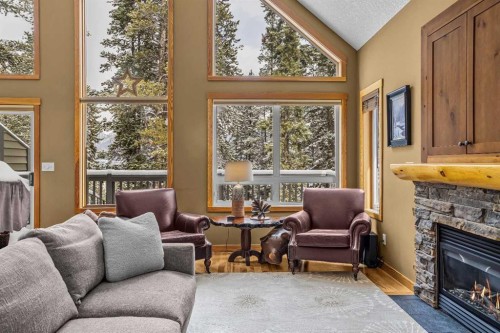 1112 Wilson Way, Canmore, AB - Indoor Photo Showing Living Room With Fireplace