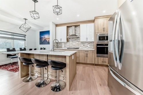 127 Saddlecrest Grove Ne, Calgary, AB - Indoor Photo Showing Kitchen With Upgraded Kitchen