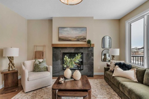 47 Sundown Crescent, Cochrane, AB - Indoor Photo Showing Living Room With Fireplace