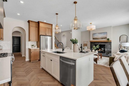 47 Sundown Crescent, Cochrane, AB - Indoor Photo Showing Kitchen With Upgraded Kitchen