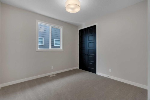 47 Sundown Crescent, Cochrane, AB - Indoor Photo Showing Other Room