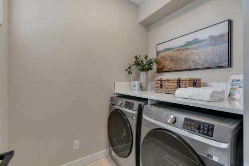 47 Sundown Crescent, Cochrane, AB - Indoor Photo Showing Laundry Room