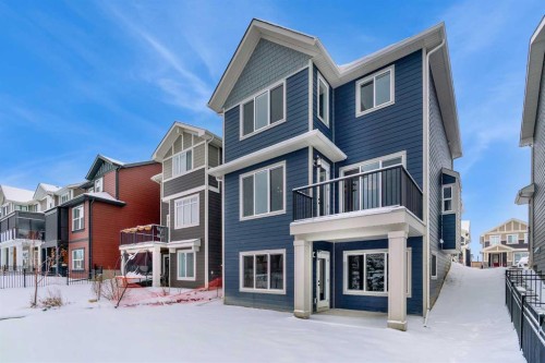 47 Sundown Crescent, Cochrane, AB - Outdoor With Facade