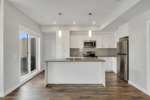 342 Canals Sw, Airdrie, AB - Indoor Photo Showing Kitchen With Stainless Steel Kitchen With Double Sink With Upgraded Kitchen