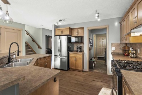 25 Tuscany Summit Terrace Nw, Calgary, AB - Indoor Photo Showing Kitchen With Double Sink