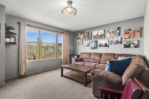 25 Tuscany Summit Terrace Nw, Calgary, AB - Indoor Photo Showing Living Room