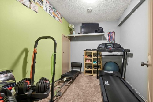 25 Tuscany Summit Terrace Nw, Calgary, AB - Indoor Photo Showing Gym Room