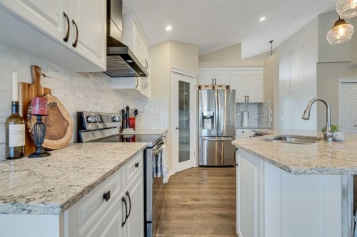 701 Cimarron Close, Okotoks, AB - Indoor Photo Showing Kitchen With Stainless Steel Kitchen With Upgraded Kitchen
