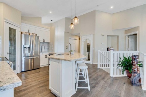 701 Cimarron Close, Okotoks, AB - Indoor Photo Showing Kitchen With Stainless Steel Kitchen With Upgraded Kitchen