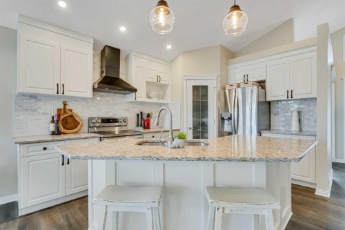 701 Cimarron Close, Okotoks, AB - Indoor Photo Showing Kitchen With Double Sink With Upgraded Kitchen