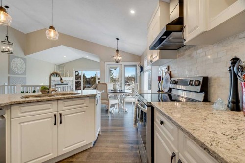 701 Cimarron Close, Okotoks, AB - Indoor Photo Showing Kitchen With Upgraded Kitchen