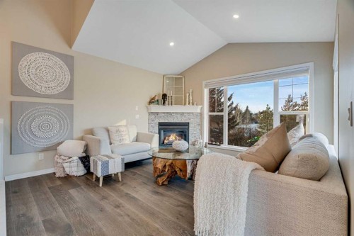 701 Cimarron Close, Okotoks, AB - Indoor Photo Showing Living Room With Fireplace