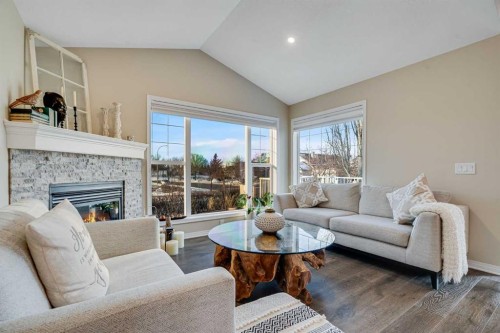 701 Cimarron Close, Okotoks, AB - Indoor Photo Showing Living Room With Fireplace