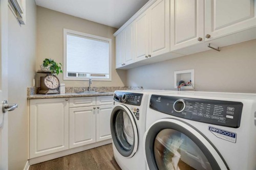 701 Cimarron Close, Okotoks, AB - Indoor Photo Showing Laundry Room