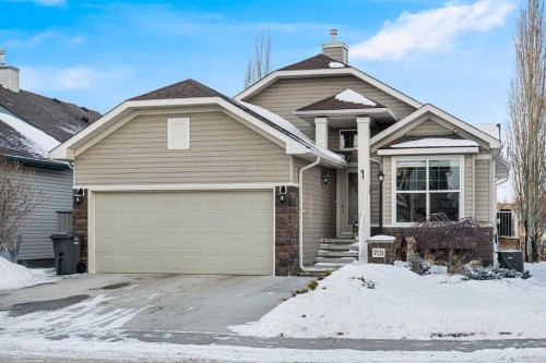 701 Cimarron Close, Okotoks, AB - Outdoor With Facade