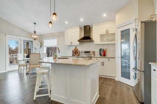 701 Cimarron Close, Okotoks, AB - Indoor Photo Showing Kitchen With Upgraded Kitchen