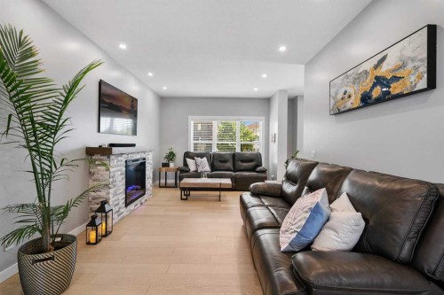 288 Copperstone Gardens Se, Calgary, AB - Indoor Photo Showing Living Room With Fireplace