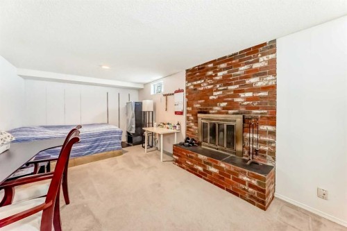 271 Dalhurst Way Nw, Calgary, AB - Indoor With Fireplace