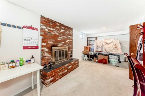 271 Dalhurst Way Nw, Calgary, AB - Indoor With Fireplace