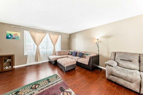 271 Dalhurst Way Nw, Calgary, AB - Indoor Photo Showing Living Room