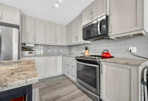 516 Sage Hill Grove Nw, Calgary, AB - Indoor Photo Showing Kitchen With Stainless Steel Kitchen