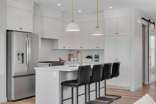 88 Sunrise Heath, Cochrane, AB - Indoor Photo Showing Kitchen With Upgraded Kitchen