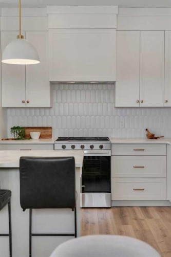 88 Sunrise Heath, Cochrane, AB - Indoor Photo Showing Kitchen