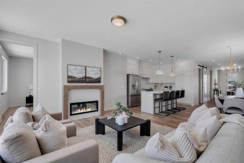 88 Sunrise Heath, Cochrane, AB - Indoor Photo Showing Living Room With Fireplace