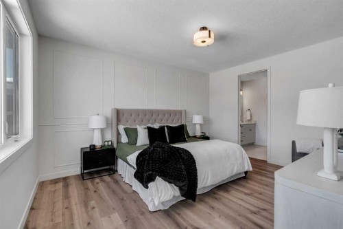 88 Sunrise Heath, Cochrane, AB - Indoor Photo Showing Bedroom